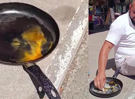 Termometre 40'ı gösterdi! Esnaf asfalt üstünde yumurta pişirip afiyetle yedi